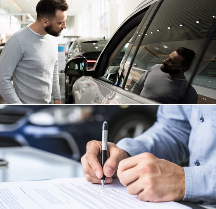 Man inspecting the exterior of a vehicle inside a dealership showroom.